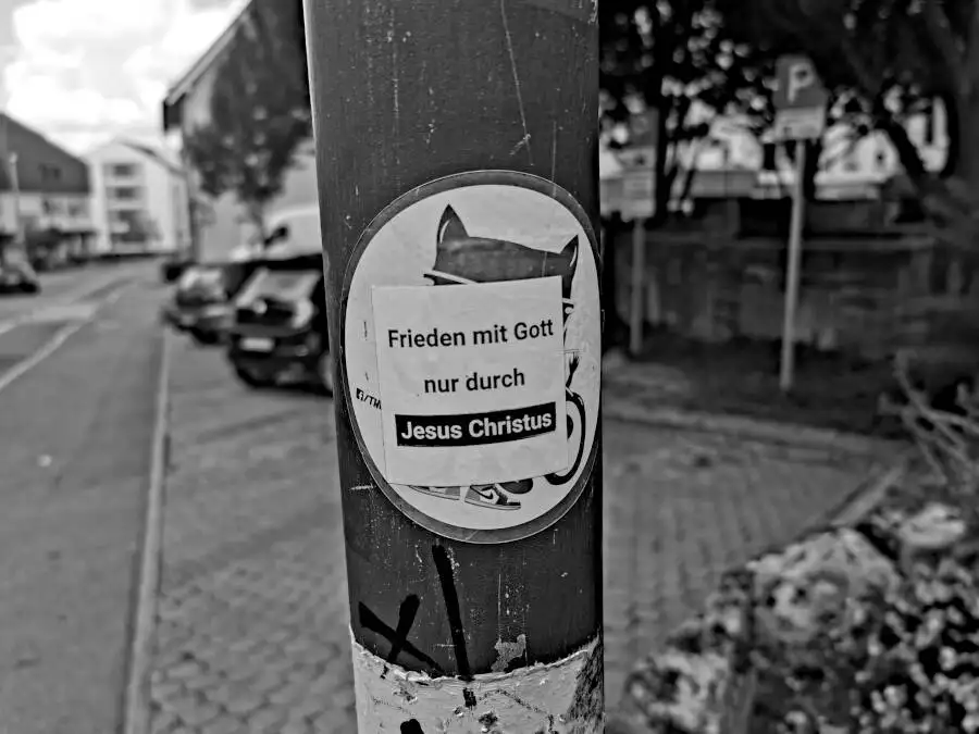 A sticker on a street lamp